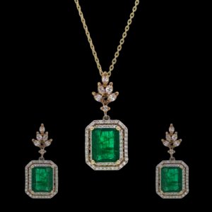 Gold set with diamonds and emerald