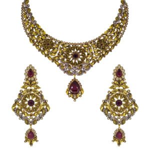 Traditional handcrafted gold necklace set with red gemstones