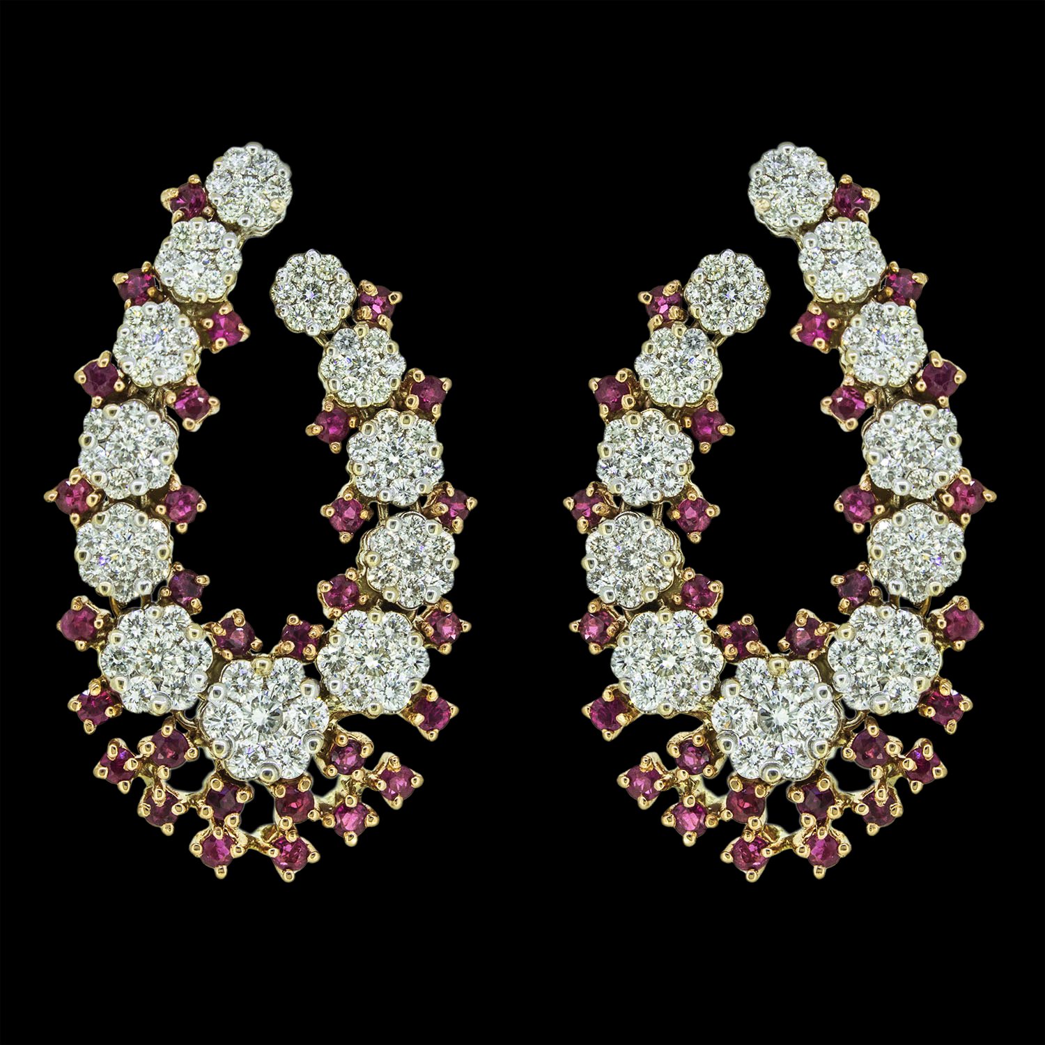 Gold earrings studded with diamonds and rubies